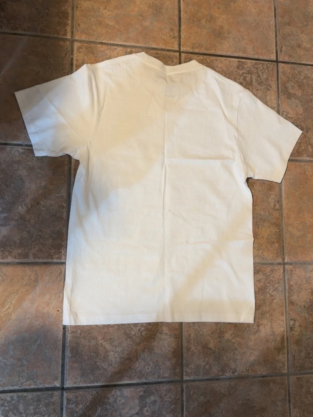Yeezy White Graphic Tee with Black Text and Multicolor Photo Accents